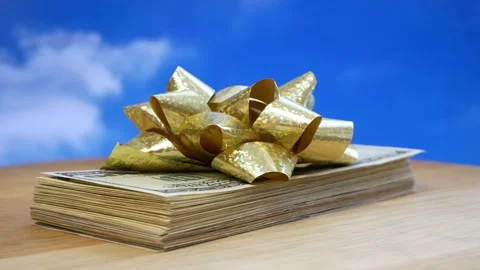 Stack of usa dollars and bow, Money gift, pile of cash with red bow, rotation Stock Footage 167662092