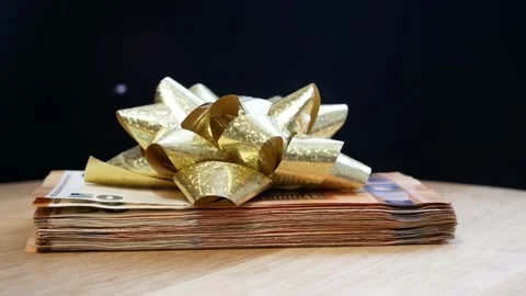 Stack of usa dollars and bow, Money gift, pile of cash with red bow, rotation Stock Footage 167662147