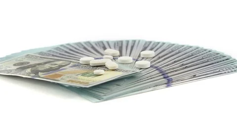 Stack of USD Dollar Money with Drugs on White Background Stock Footage 76514495
