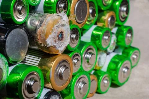 A stack of used AAA and AA size batteries. Stock Photos