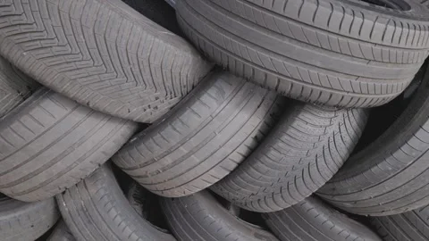 Stack of used car tires waiting to be re.. Видео 284152882