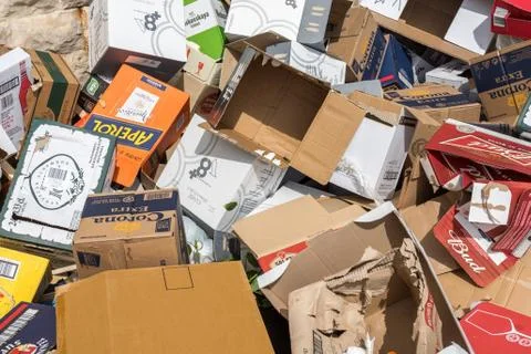 Stack of used cardboard boxes in the street 스톡 사진