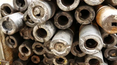 Stack of used drill pipe for oil and gas well drilling Video stock 54652255