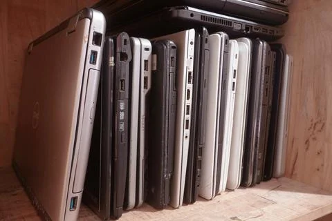 Stack of used laptops in different brand and models. That notebooks for repai Stock Photos