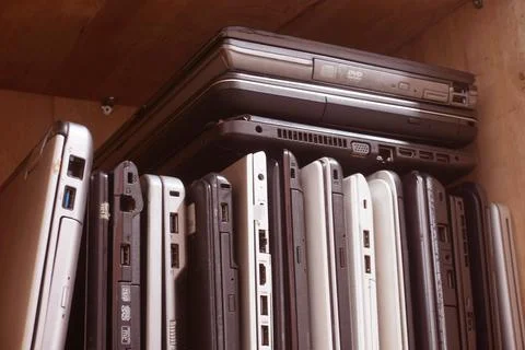 Stack of used laptops in different brand and models. That notebooks for repai Stock Photos