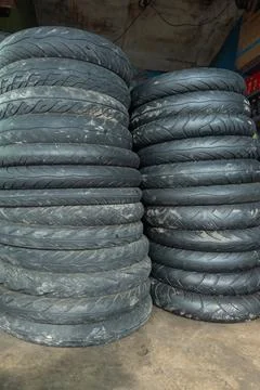 Stack of used motorcycle tires piled up Stock Photos