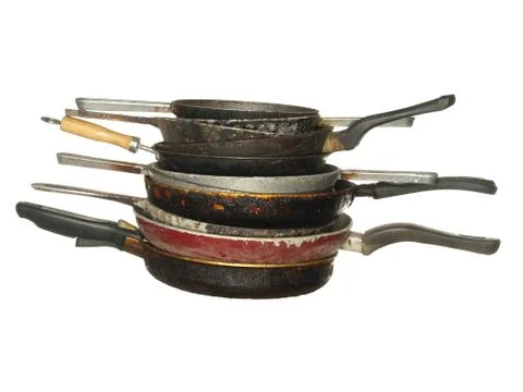 Stack of used old pans isolated on a white background. Stock Photos