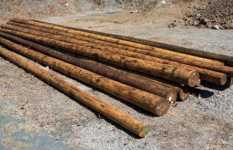 Stack of utility telephone poles Stock Photos