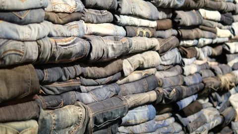 Stack of various blue jeans , Stock Footage 277927510
