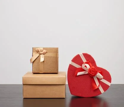 Stack of various cardboard boxes for gifts on a black table 写真素材