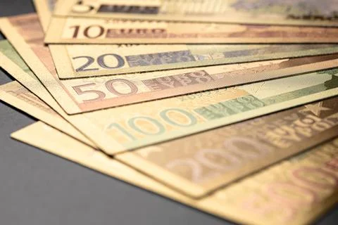 Stack of Various Euro Banknotes Arranged on a Black Background Stock Photos