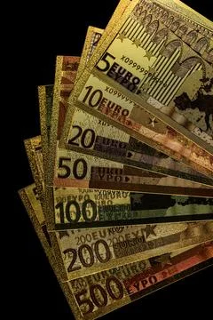 Stack of Various Euro Banknotes Arranged on a Black Background Stock Photos