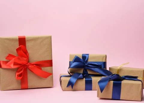 Stack of various gift boxes on a pink background Stock Photos