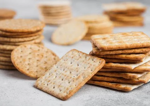 Stack of various organic crispy wheat, rye and corn flatbread crackers Stock Photos