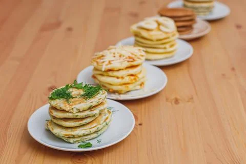 Stack of various pancakes on table, food background Stock Photos