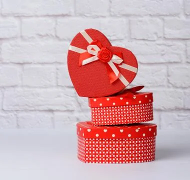 Stack of various red boxes with gifts on white background 스톡 사진