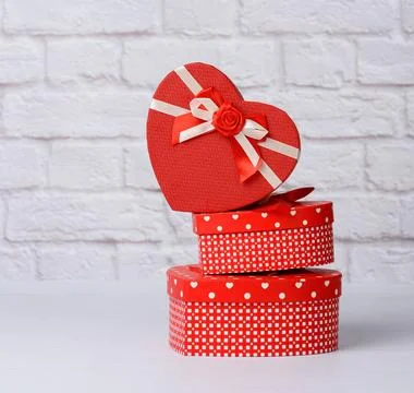 Stack of various red boxes with gifts on white background stack of various... 스톡 사진
