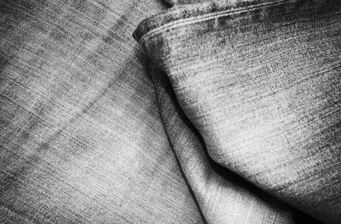 Stack of various shades of blue jeans as background Stock Photos