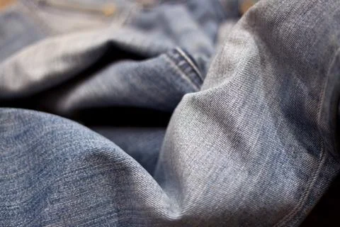 Stack of various shades of blue jeans as background Stock Photos