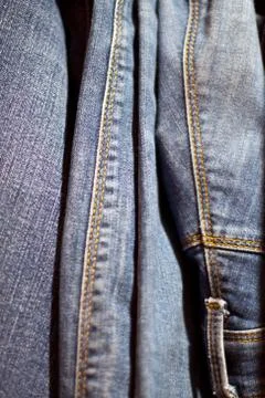 Stack of various shades of blue jeans as background Stock Photos