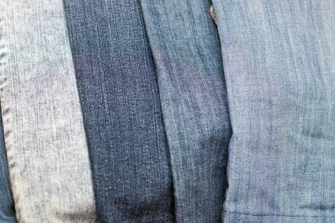 Stack of various shades of blue jeans as background Stock Photos