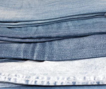 Stack of various shades of blue jeans as background Fotos de archivo