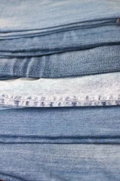 Stack of various shades of blue jeans as background Stock Photos