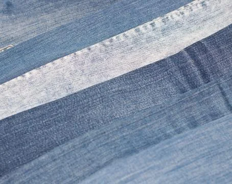 Stack of various shades of blue jeans as background Stock Photos