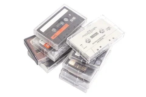 Stack of vintage audio cassettes isolated on white. Foto stock