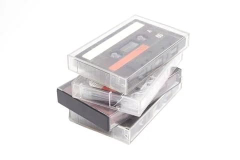 Stack of vintage audio cassettes isolated on white. Foto stock