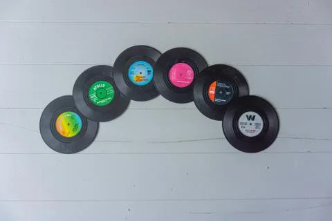 A stack of vintage colorful LP's Stock Photos