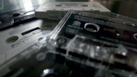 Stack of vintage compact audio cassettes representing music, entertainment, and Stock Footage 320232473