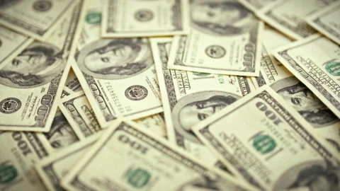 A stack of vintage dollar bills is arranged neatly on a table serving as a b Stock Footage 346388605