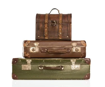 Stack of vintage leather suitcases isolated on white background Stock Photos