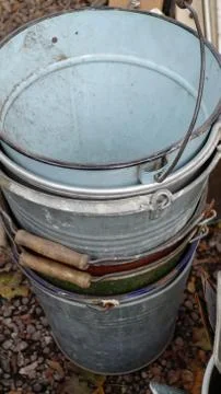 Stack of vintage metal buckets on a flea market in Berlin, Germany Stock Photos