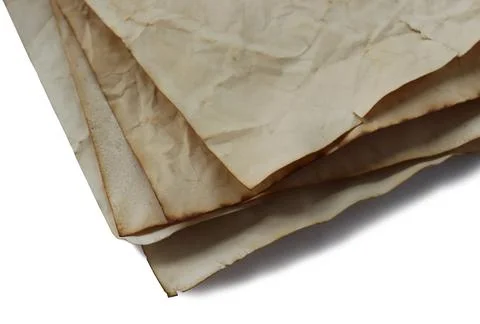 Stack of vintage old yellow paper on isolated white background Stock Photos