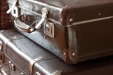 Stack of vintage retro suitcases closeup Stock Photos