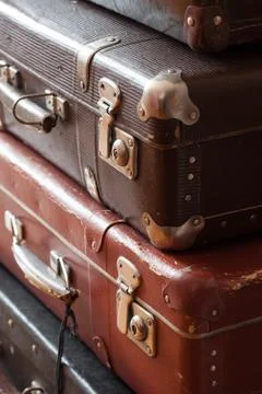 Stack of vintage suitcases closeup still life Stock Photos