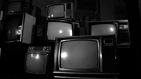 Stack of Vintage TVs in Black and White with Green Screen Turning On, BW Tone Stock Footage 91876855