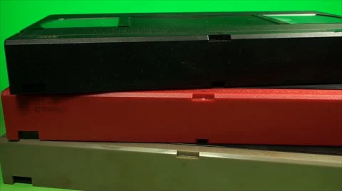 Stack Of Vintage VHS Cassettes On A Green Screen, Chroma, Key, Video, Data, Pan Stock Footage 40335856