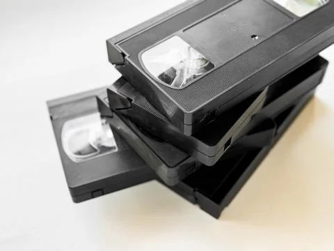 Stack of vintage vhs cassettes on light background Stock Photos
