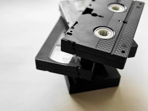 Stack of vintage vhs tapes on light background reflecting retro media nostalgia Stock Photos