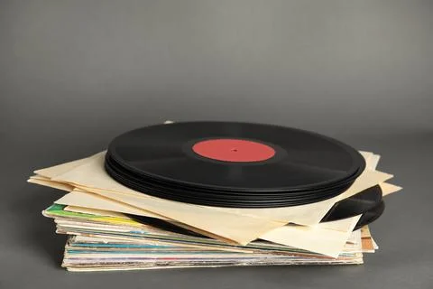 Stack of vintage vinyl records on grey background Stock Photos