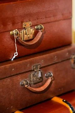 Stack of vintage worn suitcases. Stock Photos