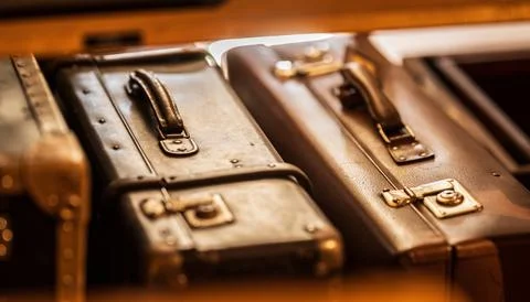 Stack of vintage worn suitcases. Stock Photos