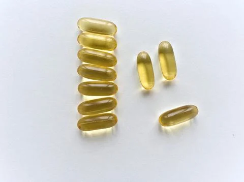 A stack of vitamin pills are on a white background Stock Photos