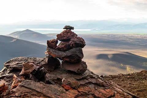 A stack of volcanic stones collected by tourists and travelers during Stock Photos