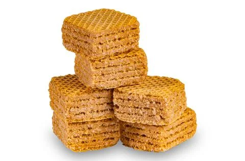 Stack of wafer filled with salted caramel flavored cream isolated on white. Stock Photos
