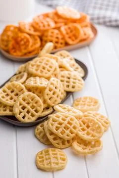 Stack of Waffle Potato Chips and Crisps on White Tabletop Snack Platter. Stock Photos