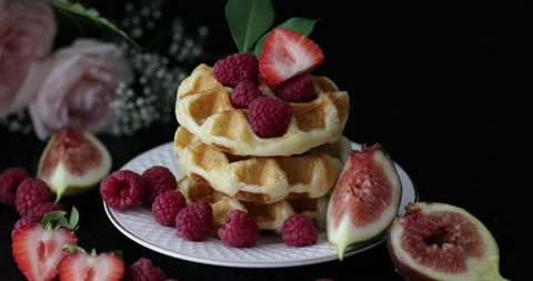 Stack of waffles and fresh figs and strawberries. Stock Footage 160158381